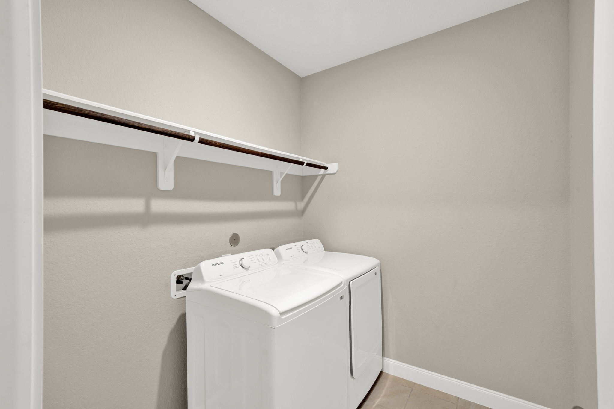 2217 Gadwall Court Conroe, TX 77384 - Photo 35 of 35 a utility room with dryer and washer