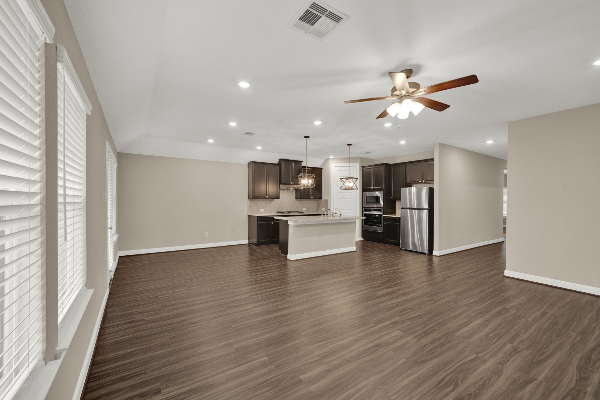 2217 Gadwall Court Conroe, TX 77384 - Photo 9 of 35 a view of kitchen with cabinets and wooden floor