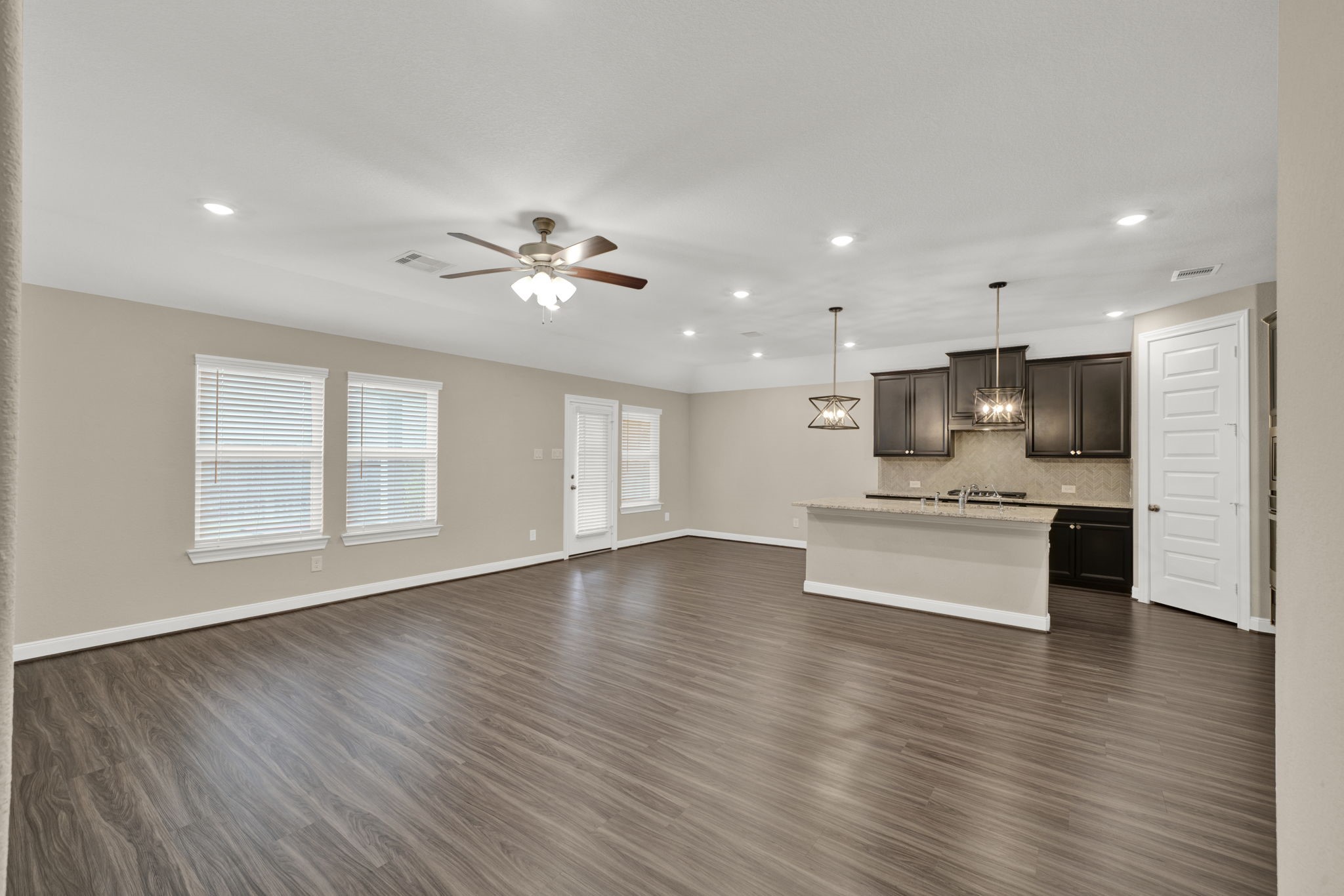 2217 Gadwall Court Conroe, TX 77384 - Photo 10 of 35 a view of kitchen with sink and wooden floor