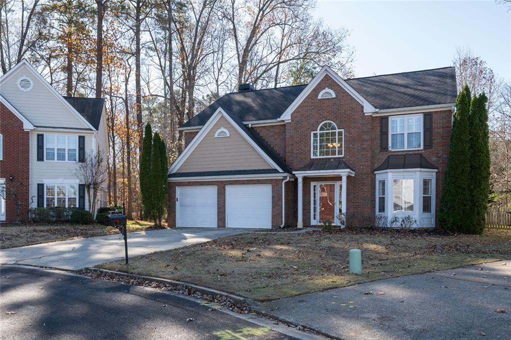 3789 Seattle Place Northwest Kennesaw, GA 30144 - Photo 2 of 40 a front view of a house with a yard
