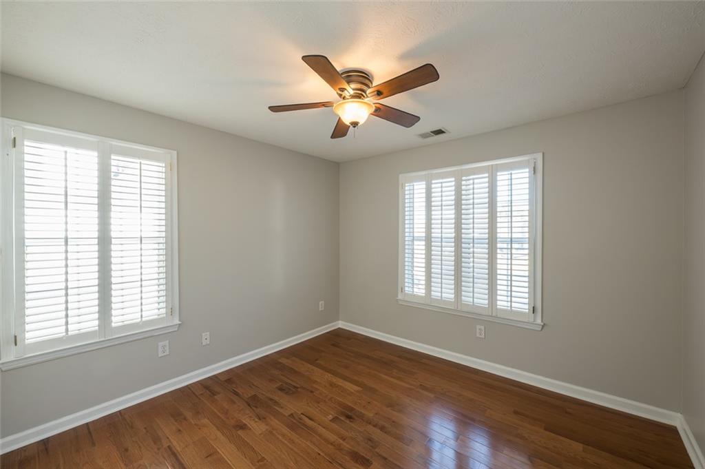 3789 Seattle Place Northwest Kennesaw, GA 30144 - Photo 30 of 40 a view of an empty room with wooden floor and a window