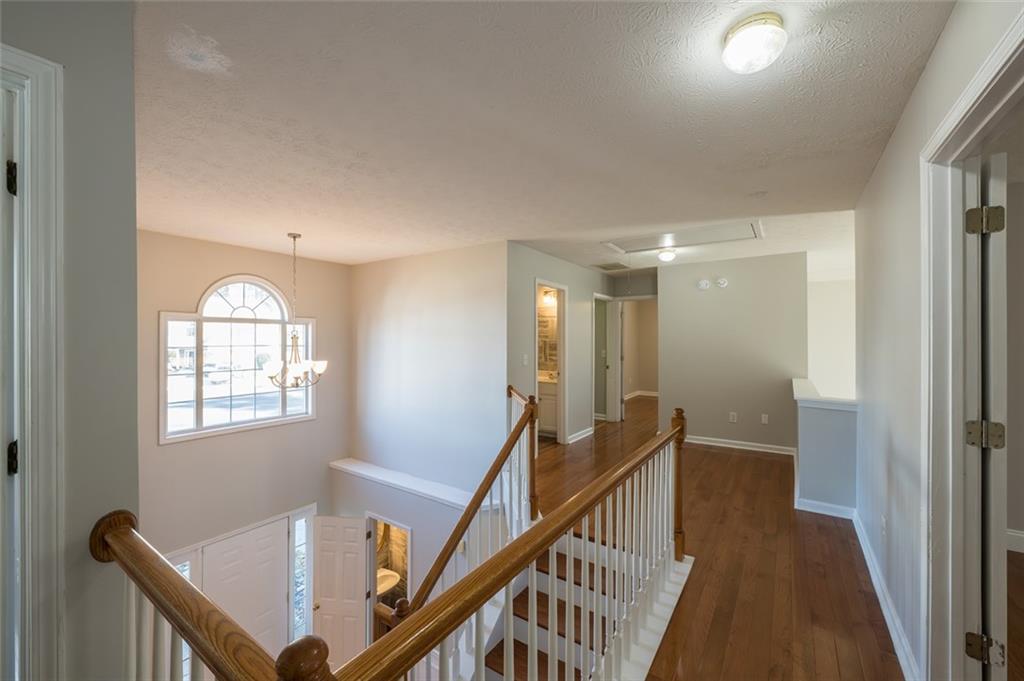 3789 Seattle Place Northwest Kennesaw, GA 30144 - Photo 32 of 40 a view of an entryway with wooden floor and stairs
