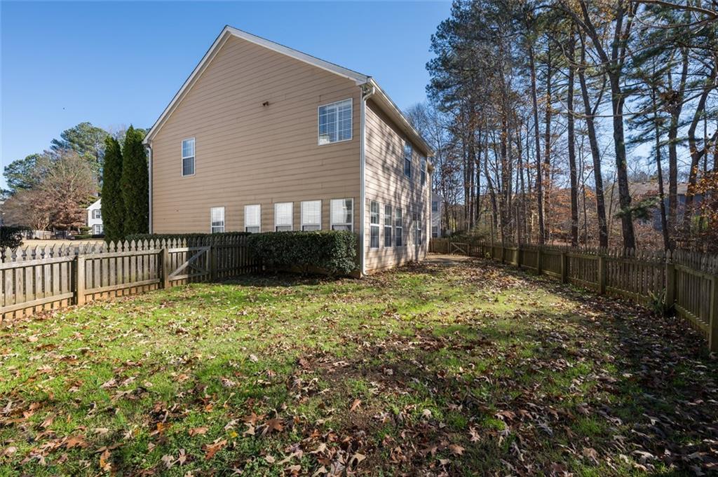 3789 Seattle Place Northwest Kennesaw, GA 30144 - Photo 39 of 40 a front view of a house with a yard