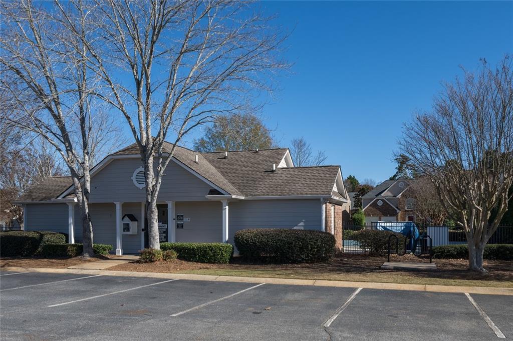 3789 Seattle Place Northwest Kennesaw, GA 30144 - Photo 40 of 40 a front view of a building with a garden and trees