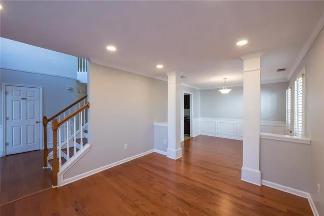 a view of an entryway with wooden floor