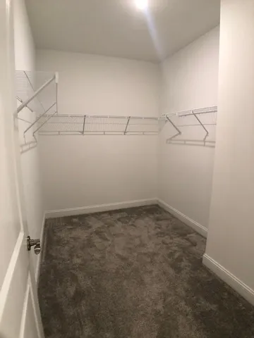 a view of a room with racks on the wall