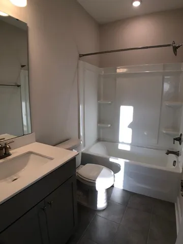 a bathroom with a sink and mirror