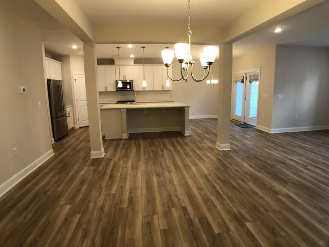 a bathroom with a sink a mirror and shower