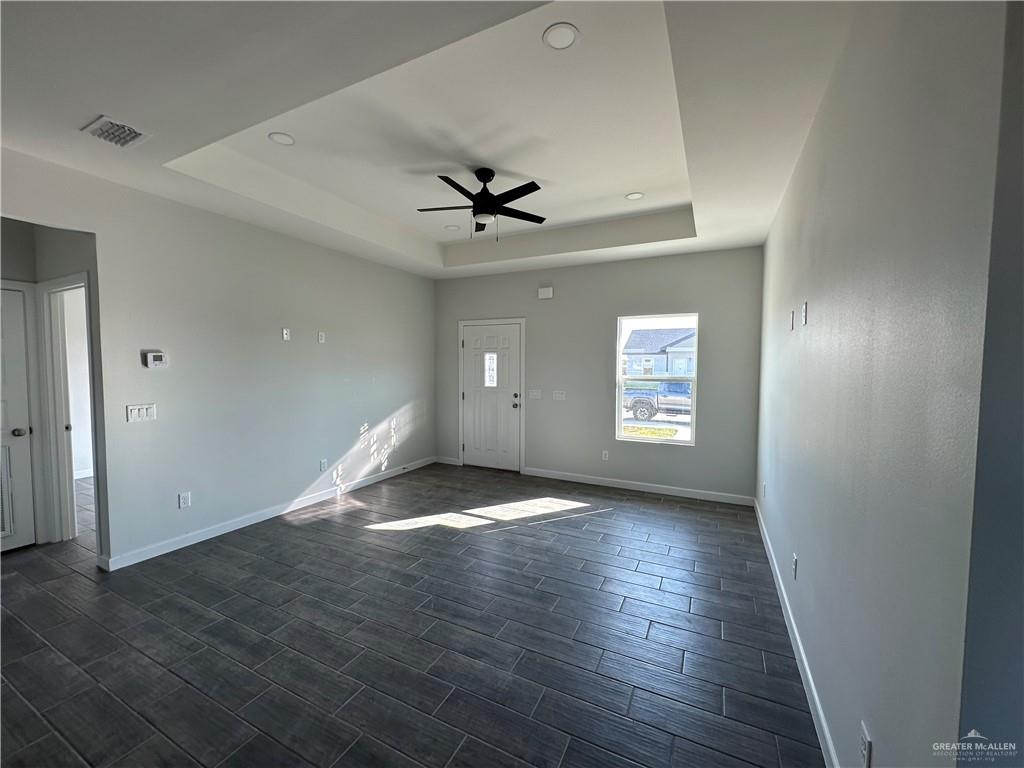 1609 Unity Drive Mercedes, TX 78570 - Photo 2 of 10 wooden floor in an empty room with a window