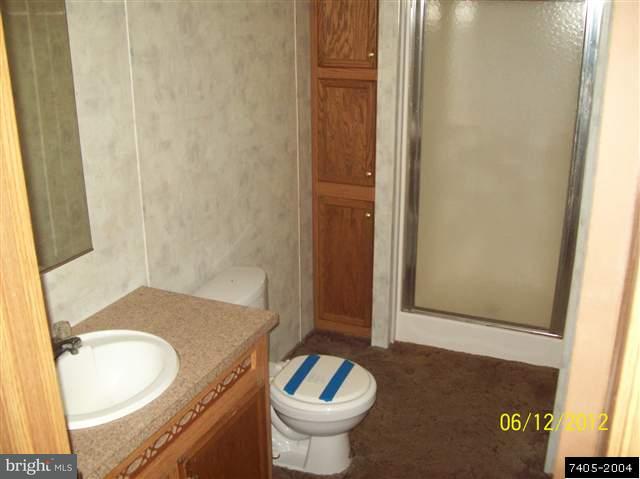 30 Hemlock Road Manchester, PA 17345 - Photo 19 of 25 a bathroom with a granite countertop sink and a mirror