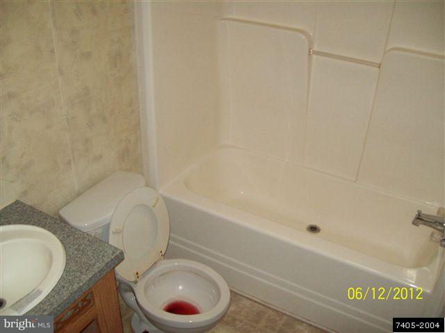 30 Hemlock Road Manchester, PA 17345 - Photo 21 of 25 a bathroom with a granite countertop toilet sink and bathtub
