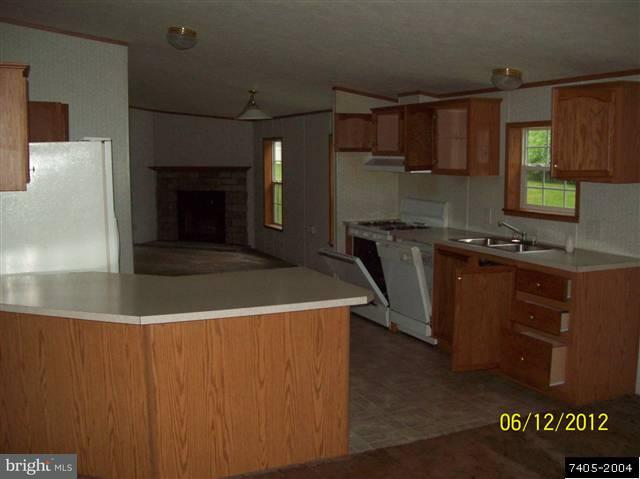 30 Hemlock Road Manchester, PA 17345 - Photo 6 of 25 a kitchen with kitchen island granite countertop a sink stainless steel appliances and cabinets