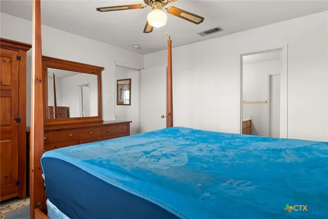 a spacious bathroom with a double vanity sink and a mirror