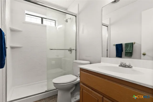 a bedroom with furniture and a window