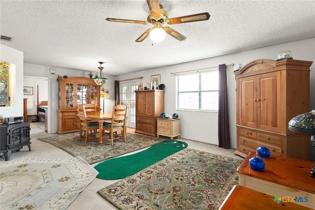 a dining room with furniture and window
