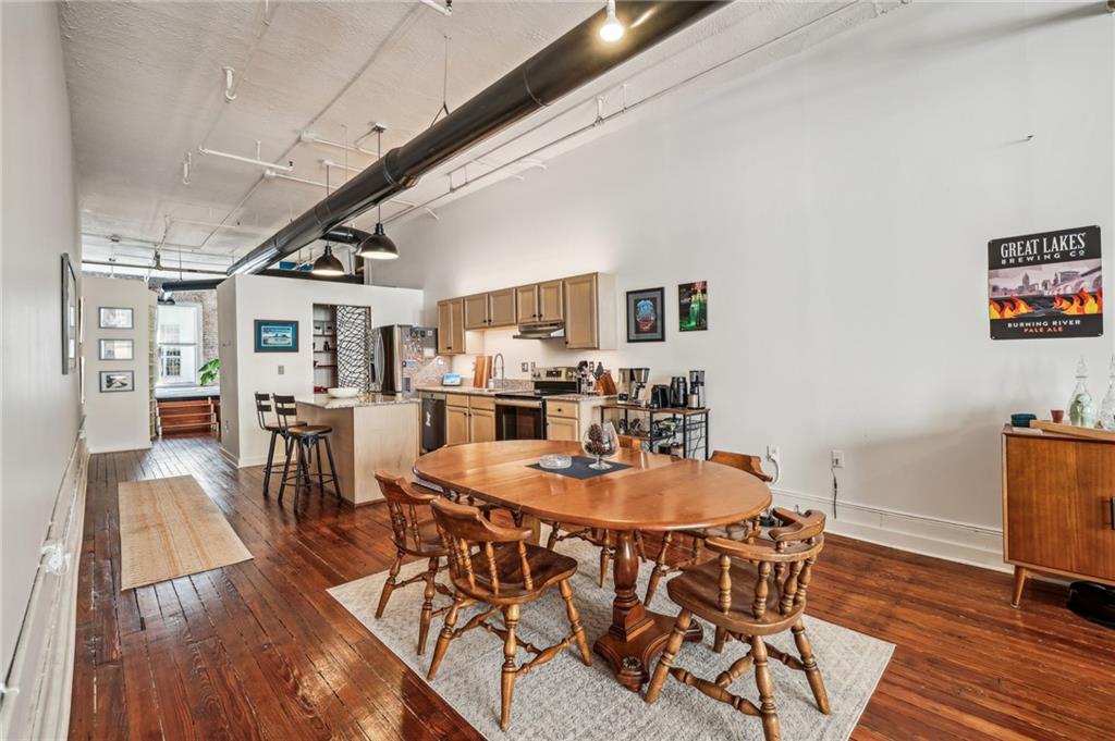 215 Mitchell Street Southwest, Unit 19 Atlanta, GA 30303 - Photo 12 of 29 a dining room with furniture and wooden floor