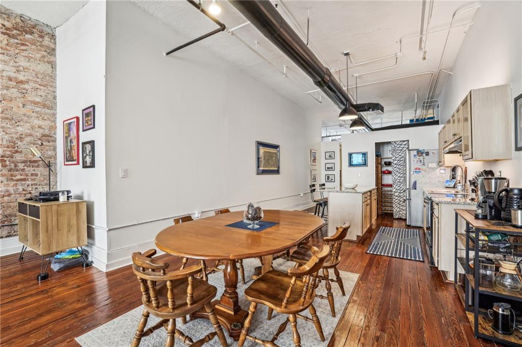 215 Mitchell Street Southwest, Unit 19 Atlanta, GA 30303 - Photo 13 of 29 a dining room with furniture and wooden floor