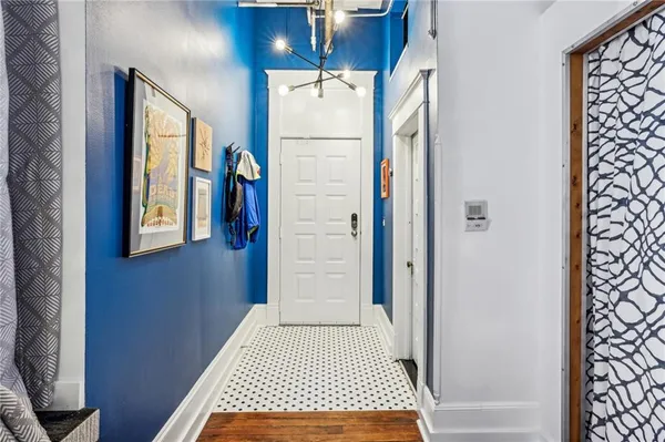 a bathroom with a window and a shower