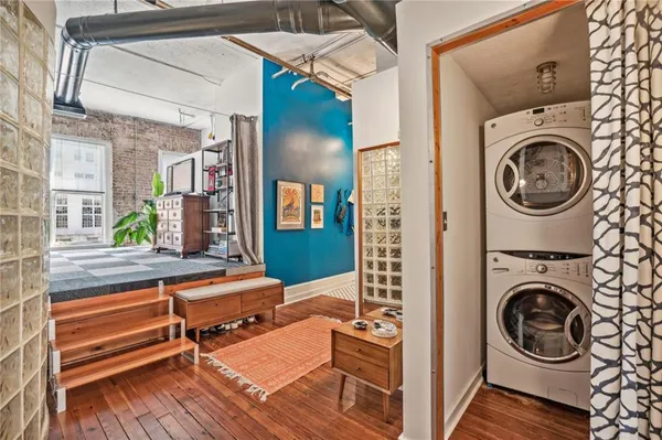 a view of a bedroom with washer and dryer