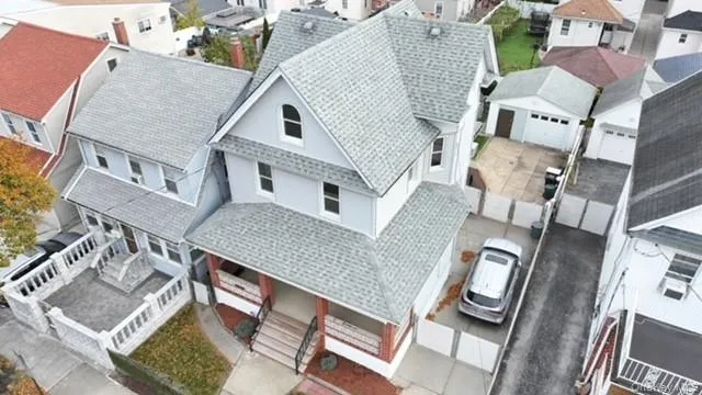 an aerial view of a house with a big yard