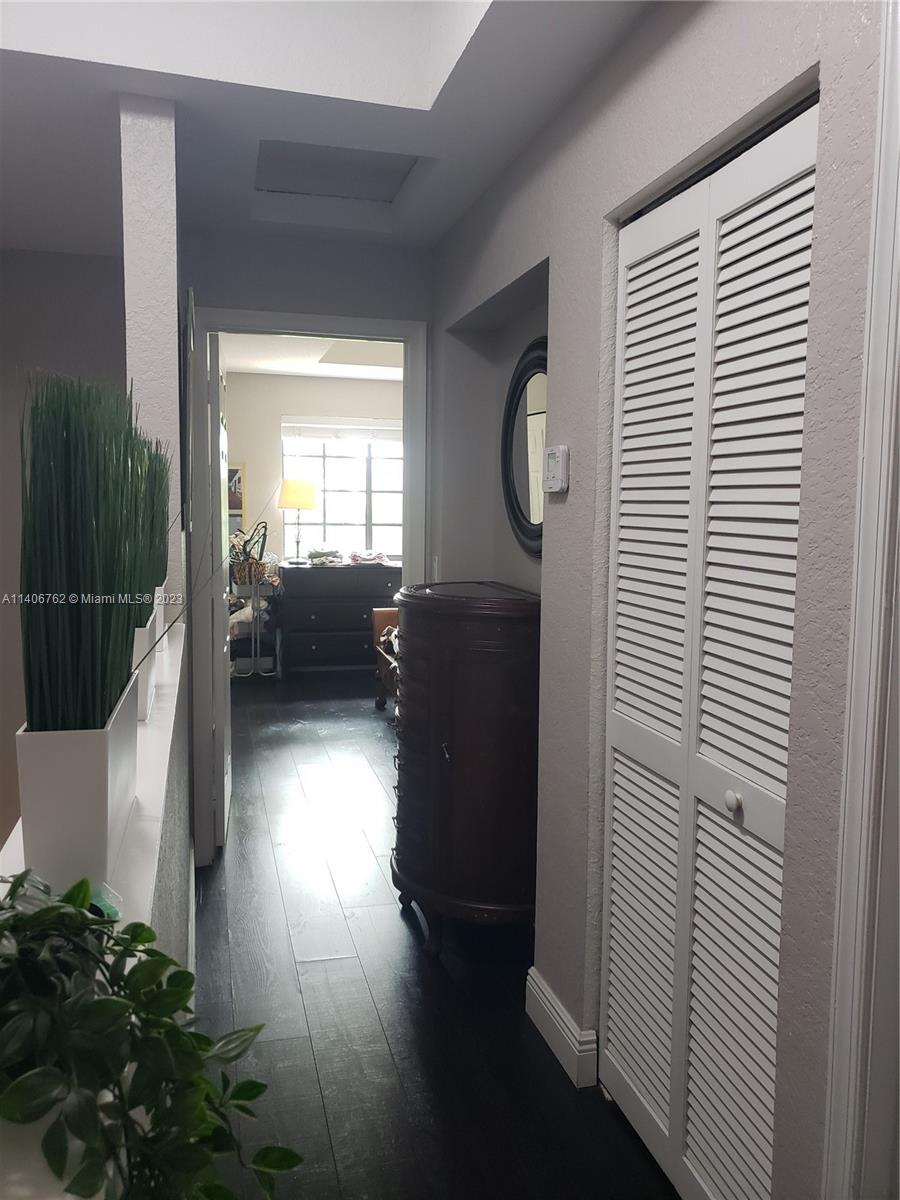 3933 Tree Top Drive, Unit 3933 Weston, FL 33332 - Photo 17 of 27 a living room with furniture and a window