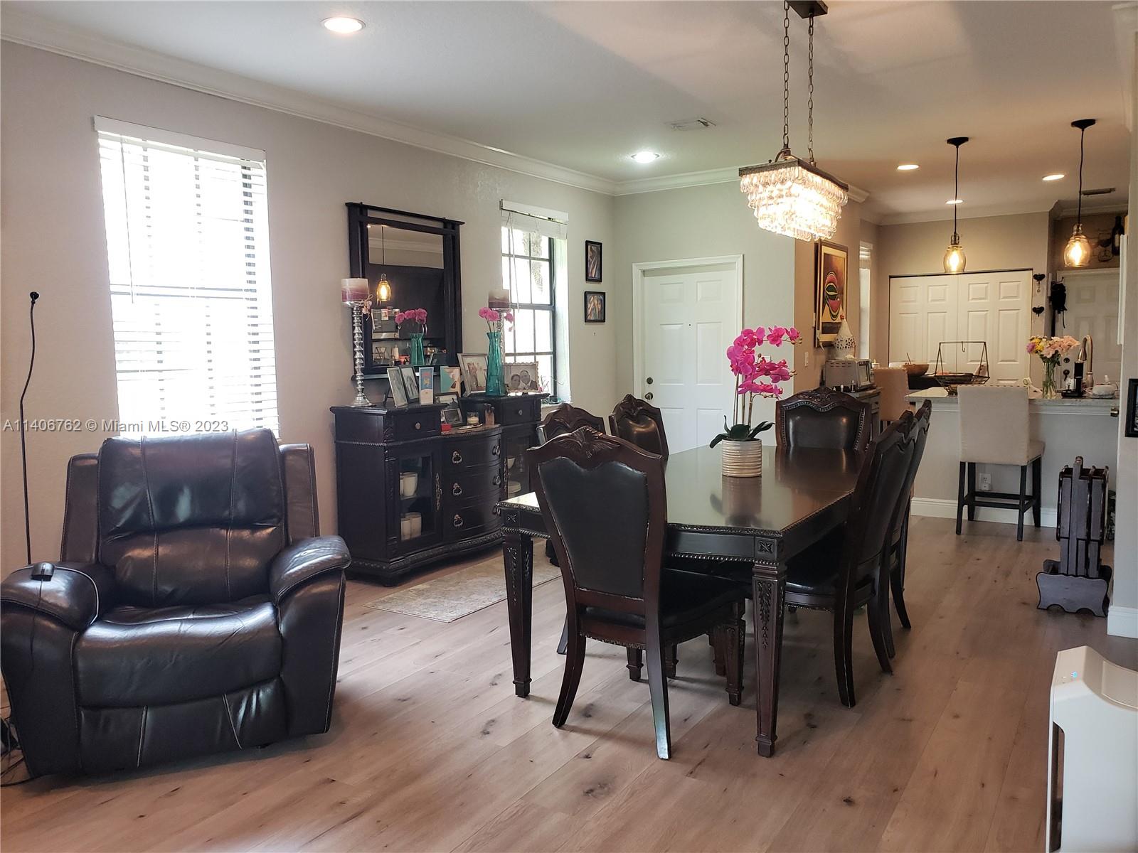 3933 Tree Top Drive, Unit 3933 Weston, FL 33332 - Photo 5 of 27 a view of a dining room with furniture and window