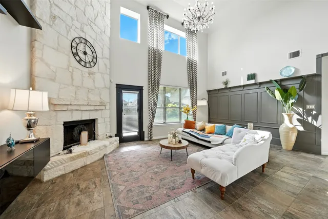 a living room with furniture and a fireplace