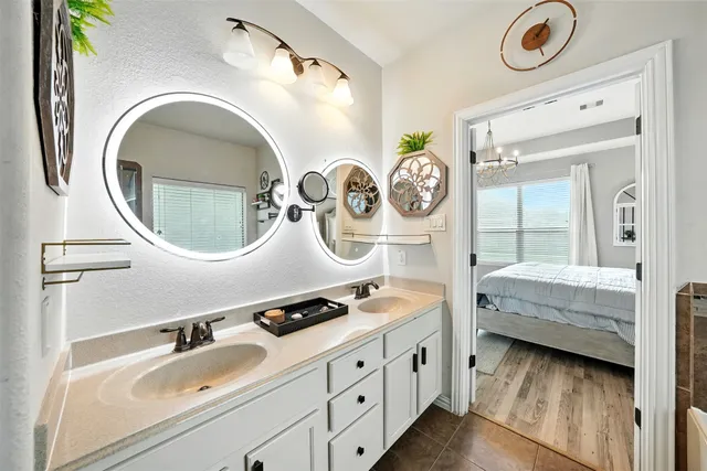 a bathroom with a sink and a mirror