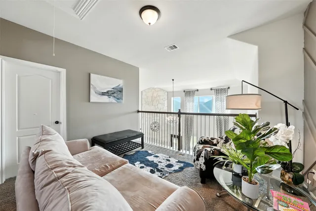 a bedroom with furniture potted plant and a window