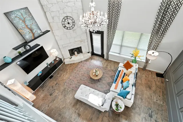 an aerial view of a house with outdoor space and a lake view