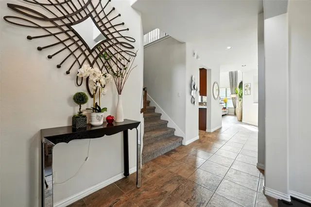 a view of entryway and hall with a hallway