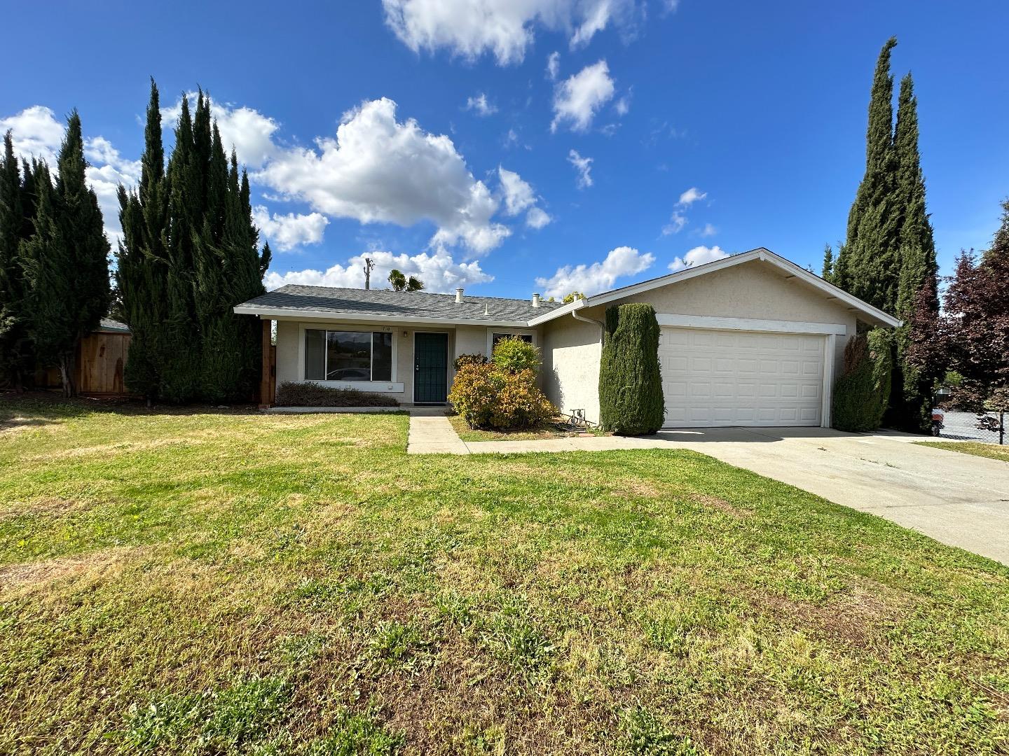 1710 Merrill Loop San Jose, CA 95124 - Photo 1 of 11 a front view of a house with a garden