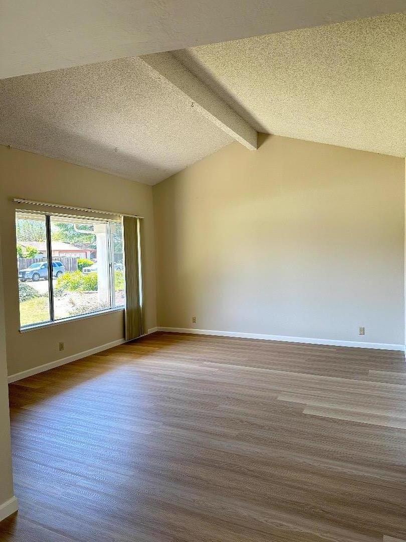 1710 Merrill Loop San Jose, CA 95124 - Photo 2 of 11 wooden floor in an empty room with a window