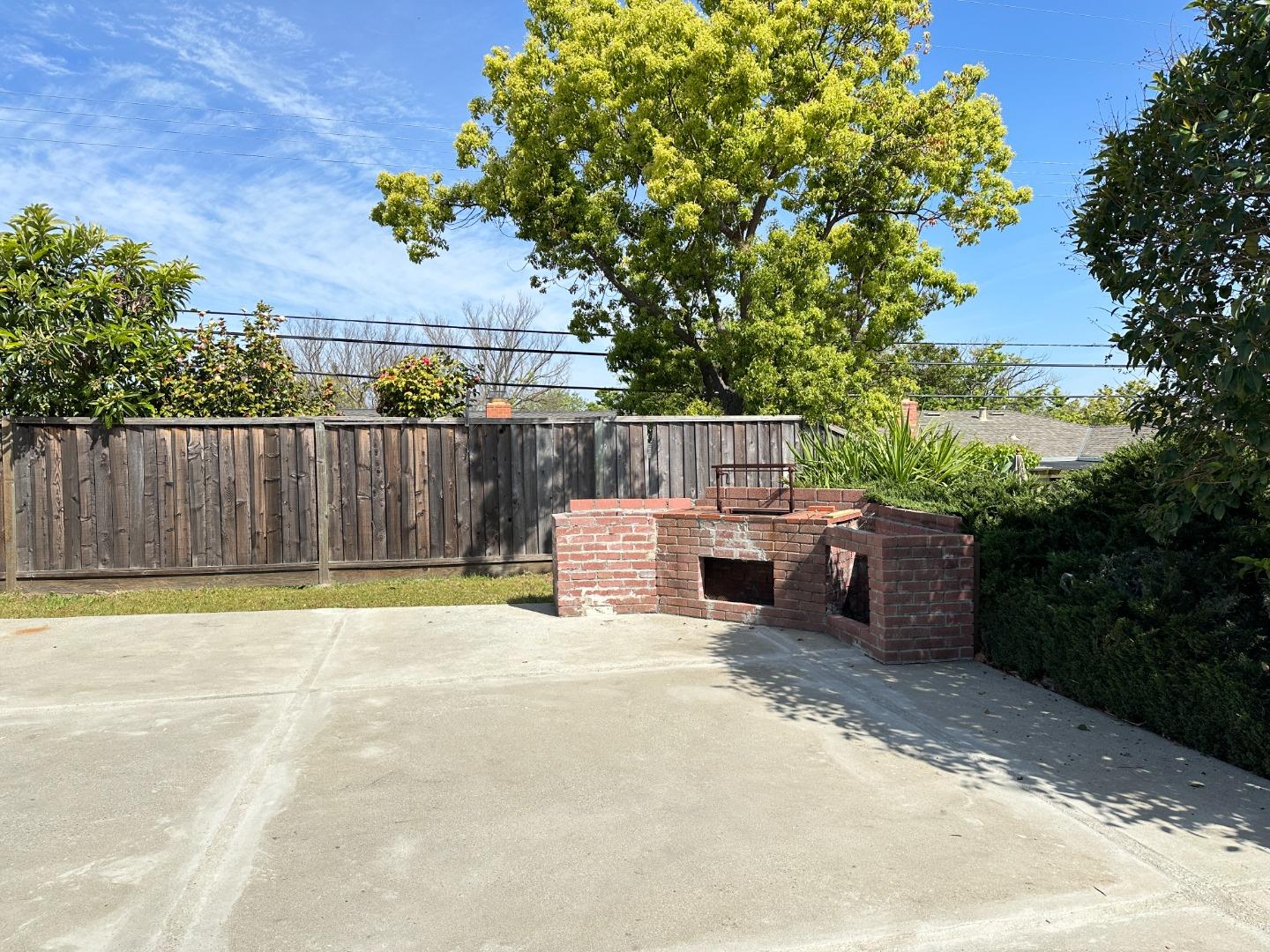 1710 Merrill Loop San Jose, CA 95124 - Photo 10 of 11 a view of a patio with table and chairs with wooden fence and plants