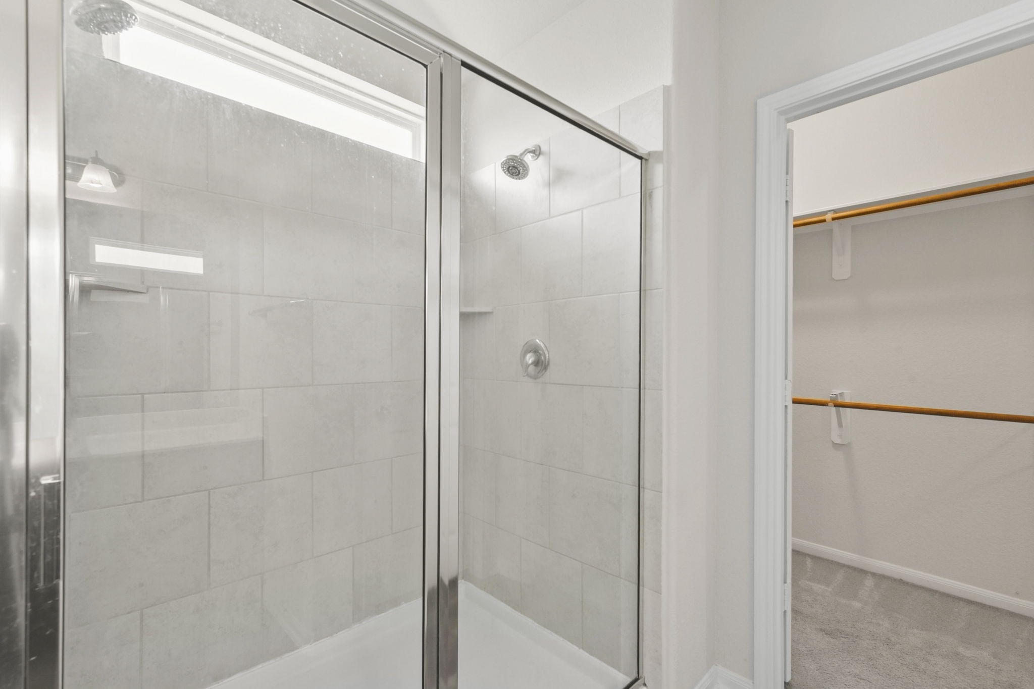 3011 Tandem Court Rosenberg, TX 77471 - Photo 15 of 29 a bathroom with a glass shower door