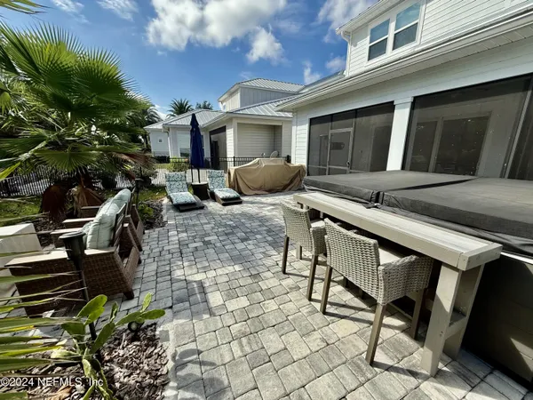 a view of a chairs and table in the patio