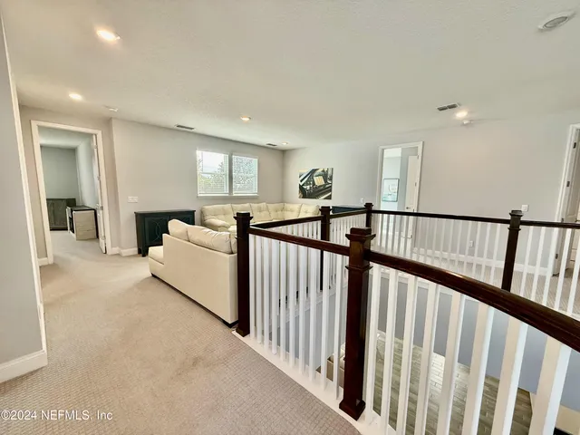 a view of a livingroom with furniture and windows