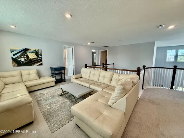 a living room with furniture and a couch