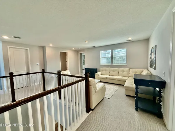 a view of a livingroom with furniture and a couch