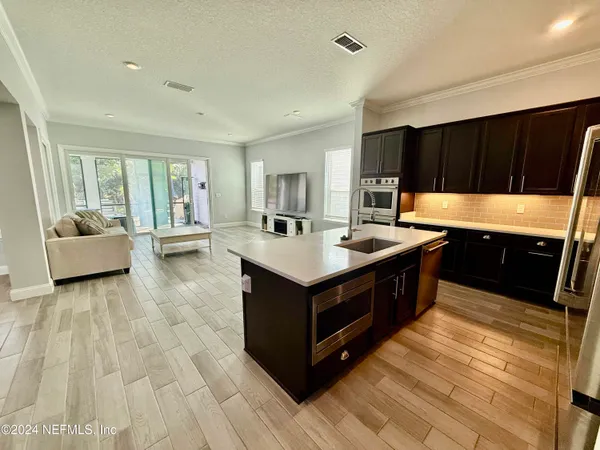 a kitchen with a stove and a sink