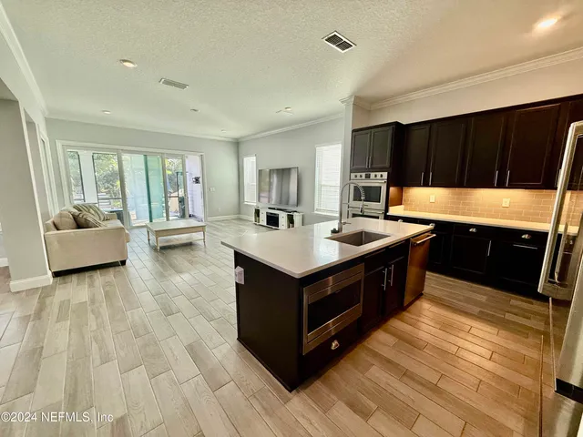 a kitchen with a stove and a sink
