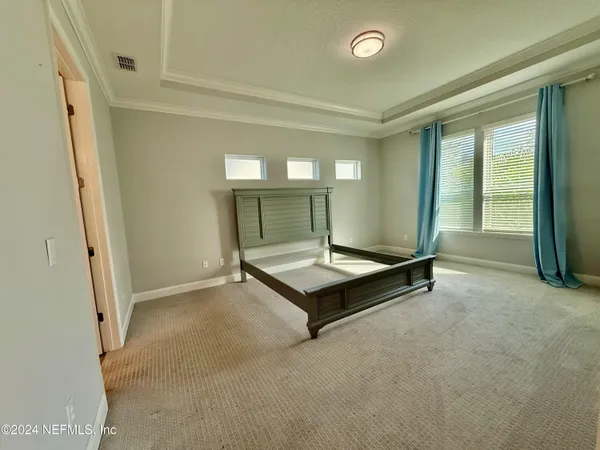 a room with pool table and a window