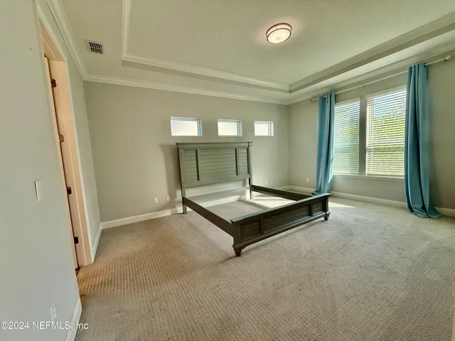 a room with pool table and a window