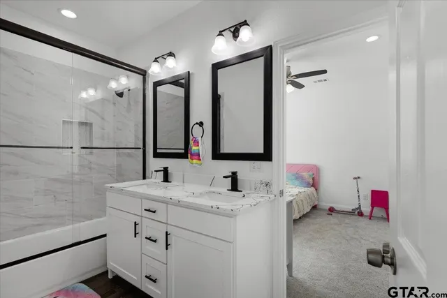 a bathroom with a sink and a mirror