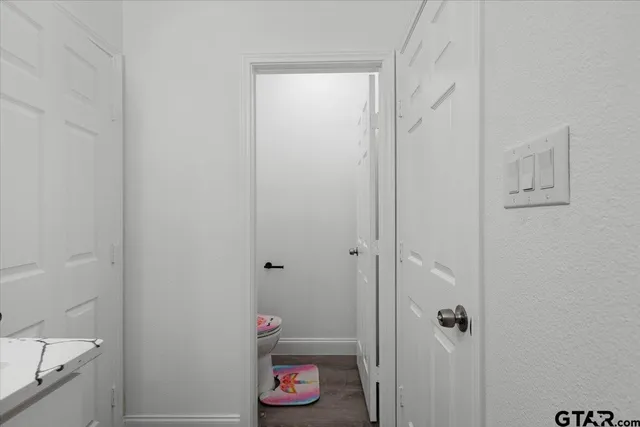 a bathroom with a shower and toilet