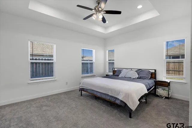 a bedroom with a bed and window