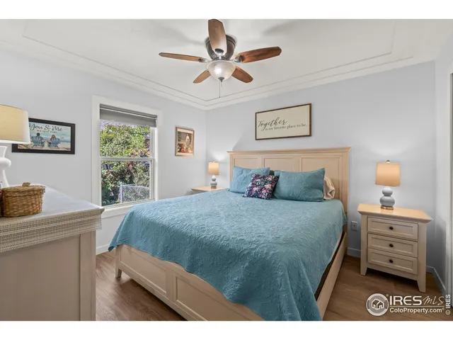 a bedroom with a bed and a tv