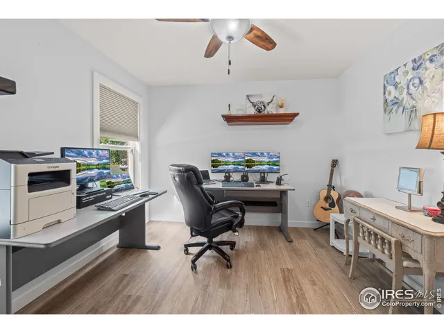 a workspace with furniture and wooden floor