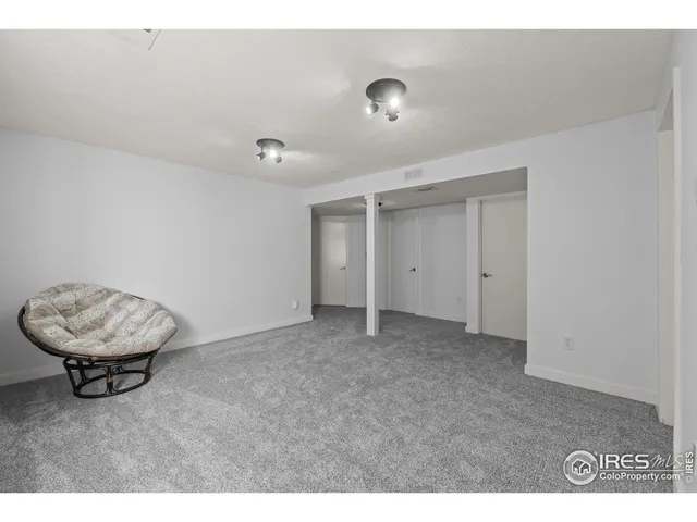 a view of an empty room and a window