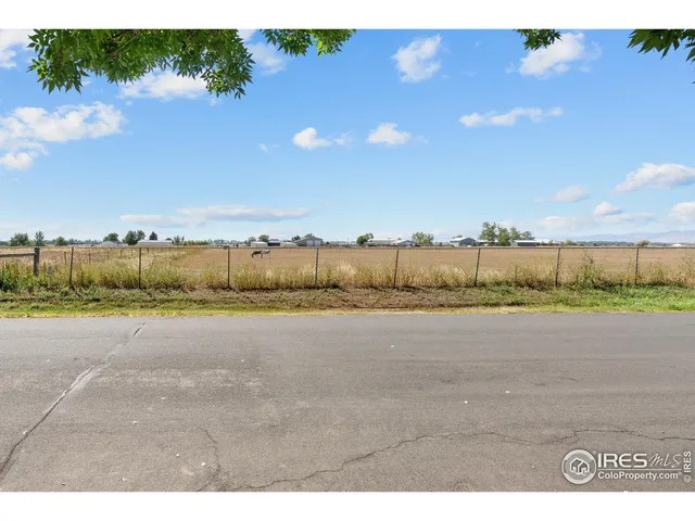 a view of a town with mountains in the background